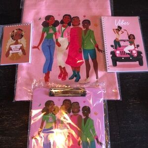 Tote with clip board. 2 note pads. Pink color and girls drawing on it!